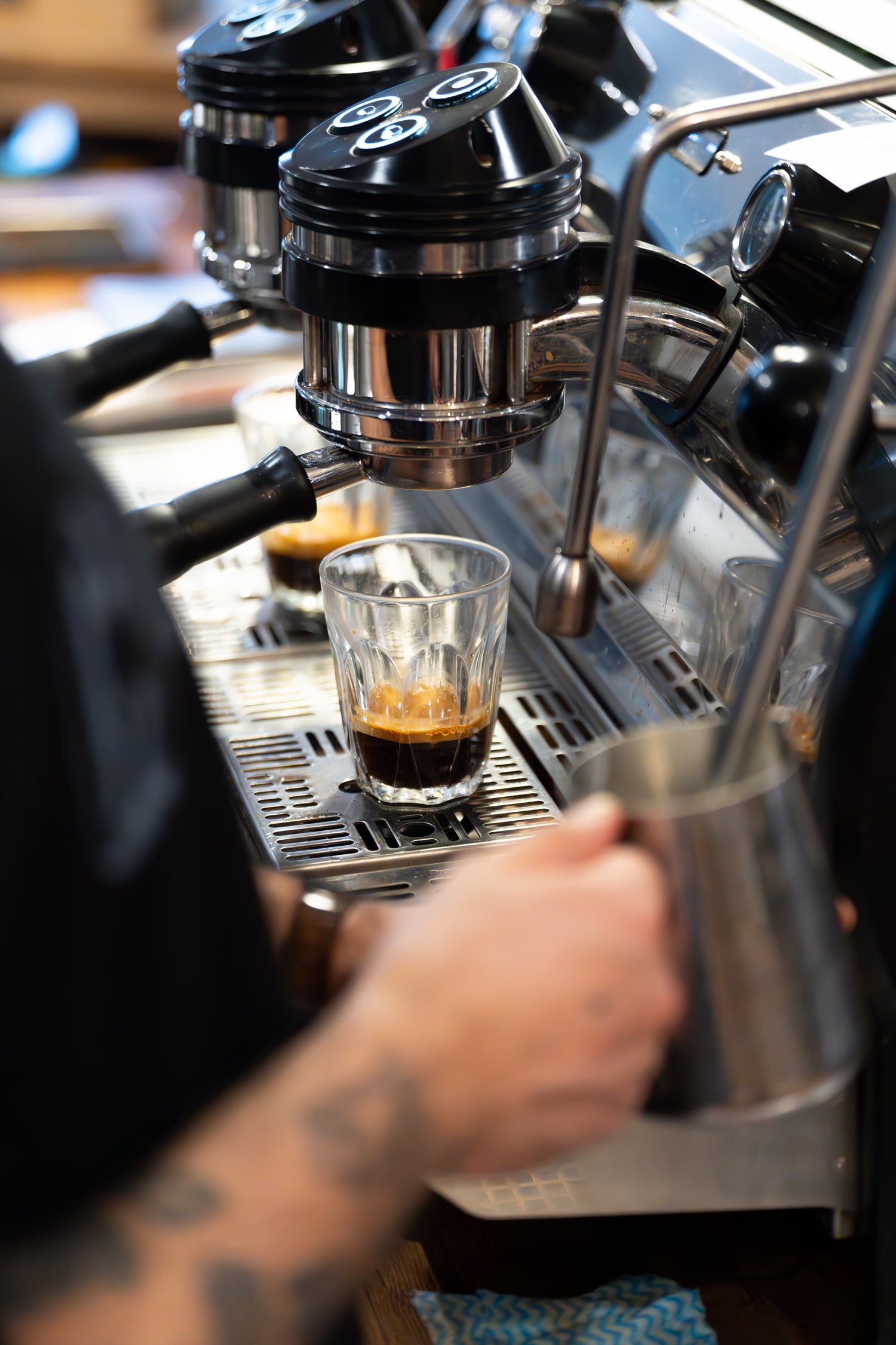 Espresso machine being used to make a shot of speciality coffee espresso.