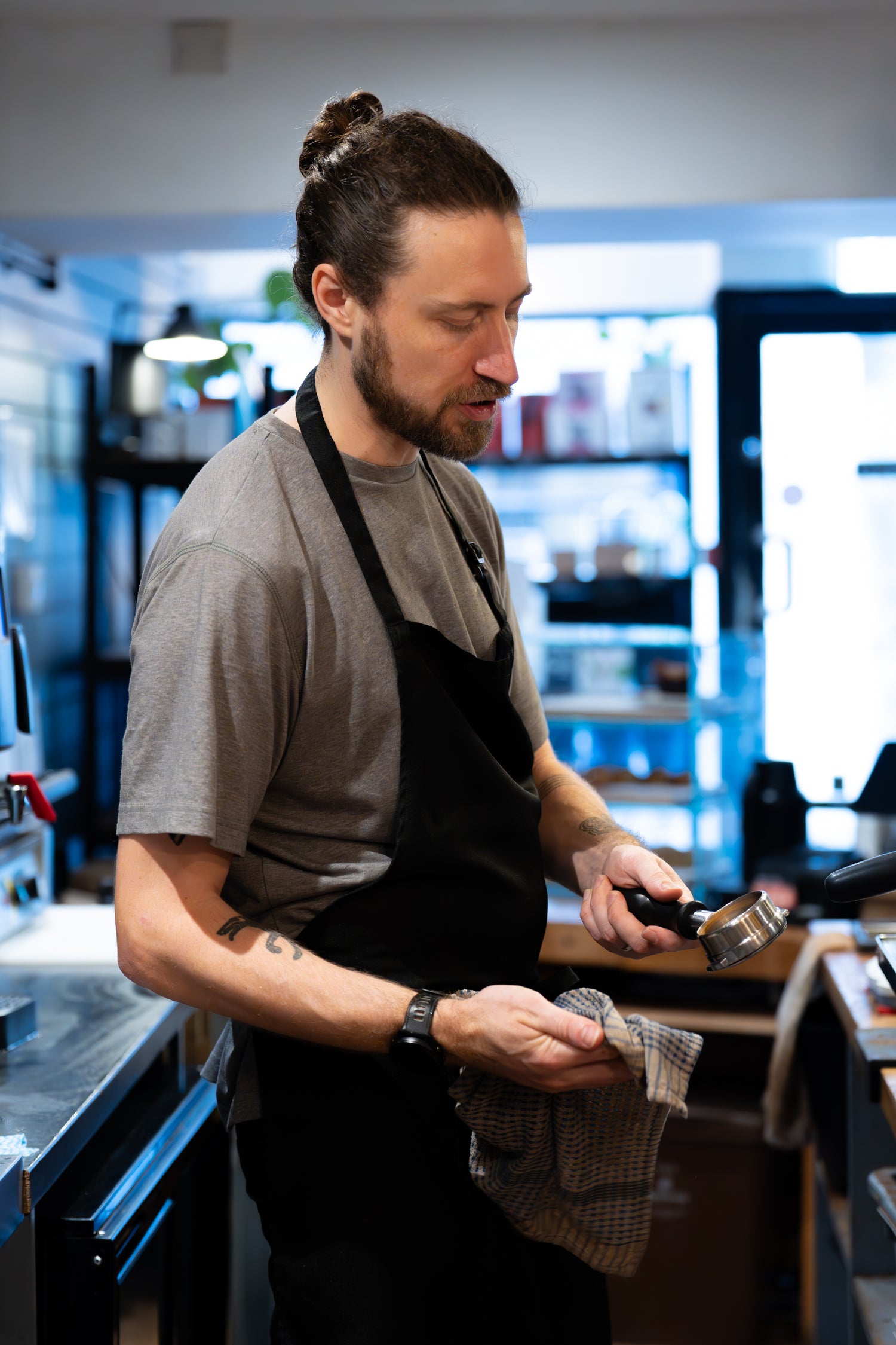 Founder of Freda Speciality Coffee Roaster working in his cafe, Bond Street Coffee