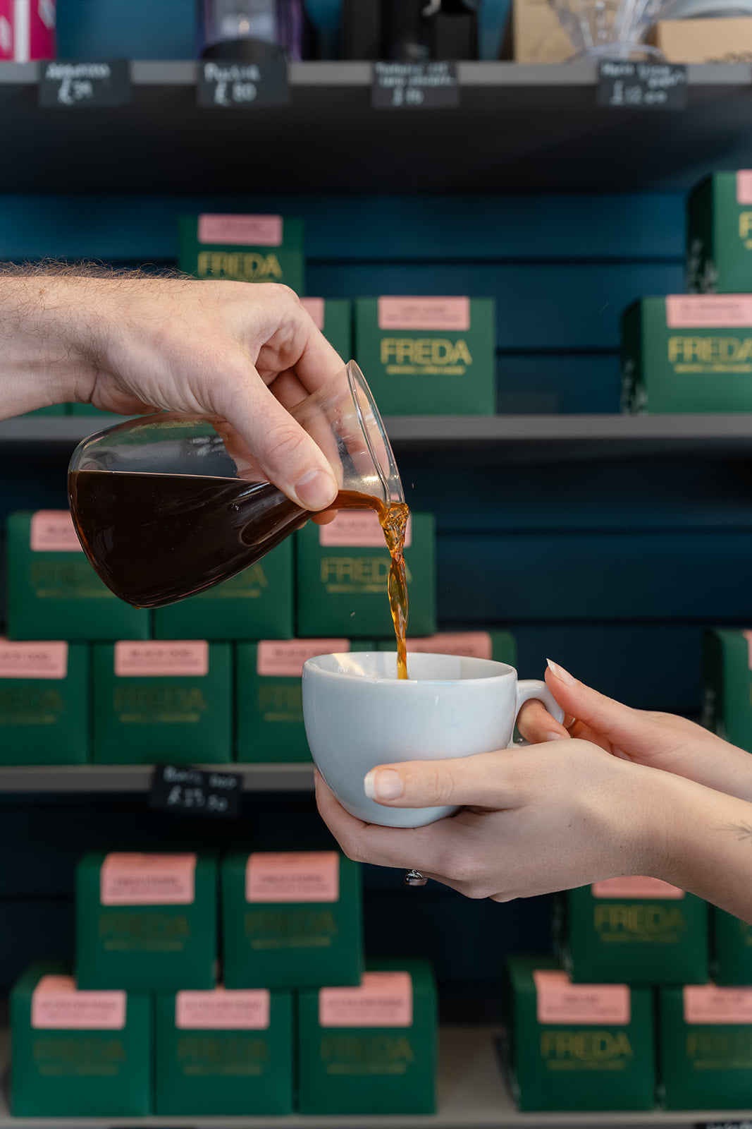 Pouring premium Freda single origin filter coffee in Hario decanter