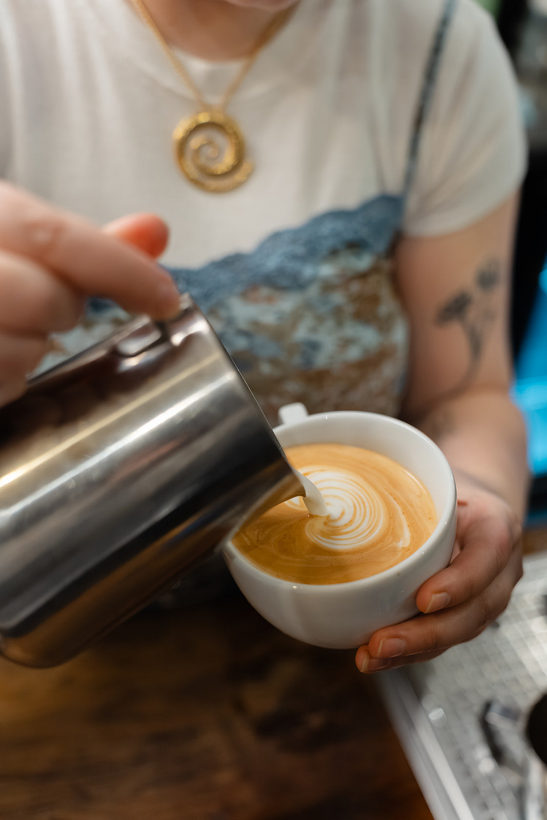 Pouring Latte Art in Bond Street Coffee, Brighton's best coffee shop