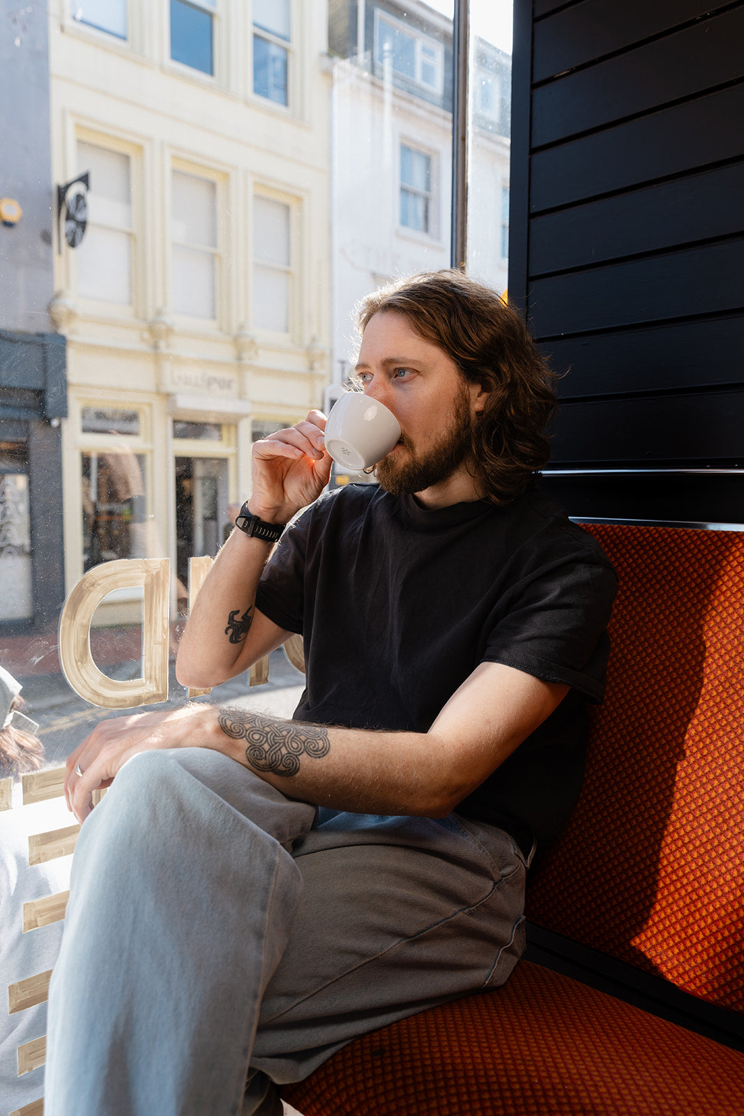 Chris drinking coffee in his cafe, Bond Street Coffee, Specialty Coffee Brighton