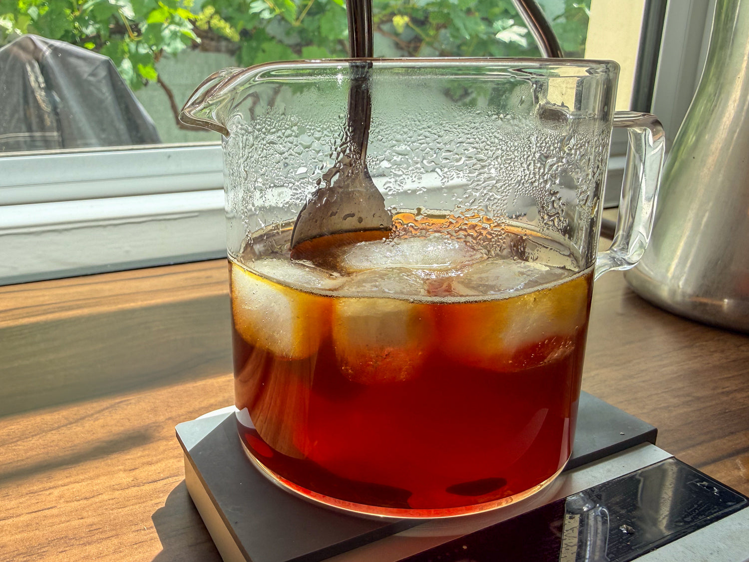 Stirring Ice into coffee, with our speciality coffee subscription 