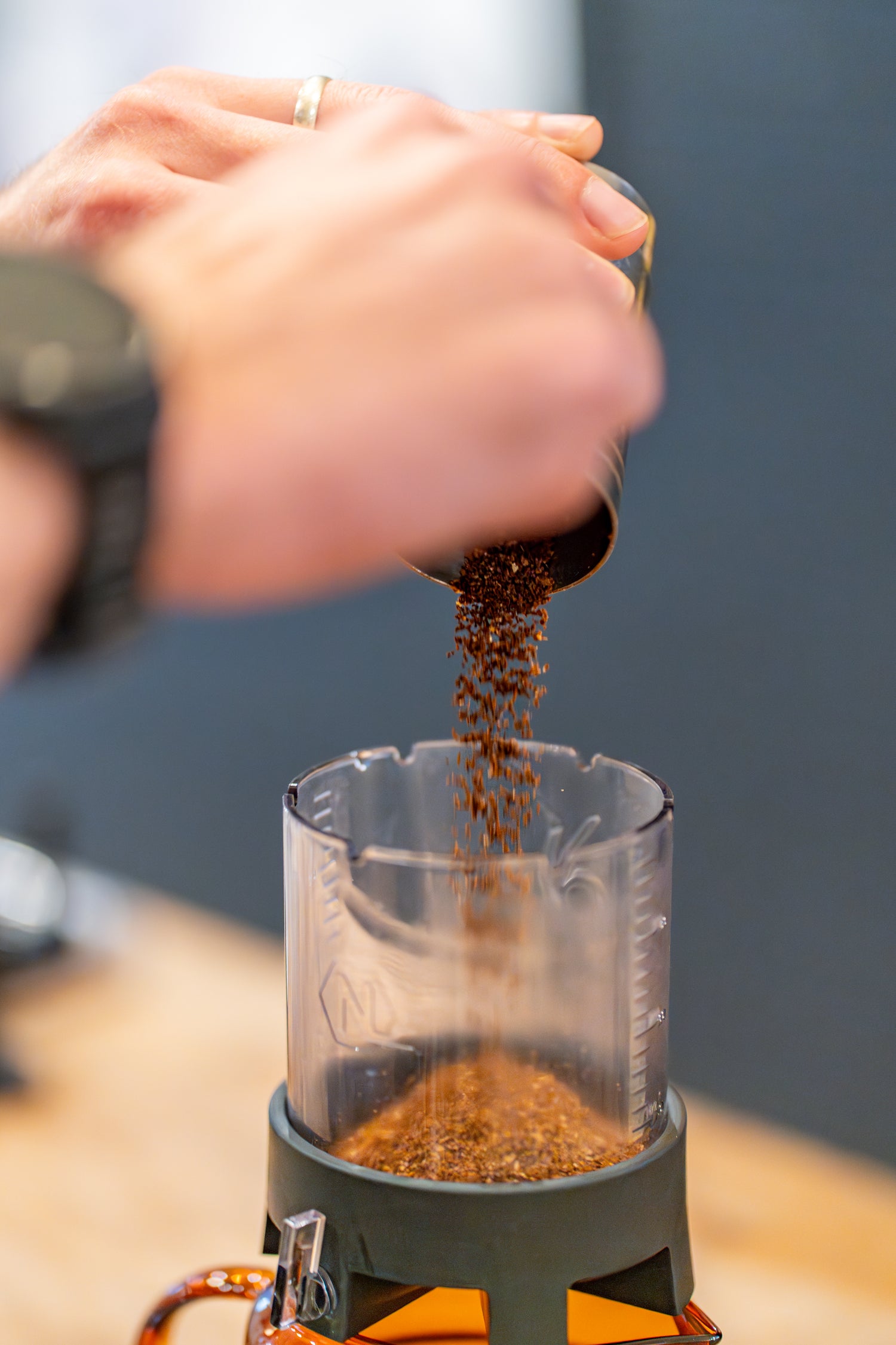Pouring freshly ground coffee to the Next Level Pulsar Coffee Brewer