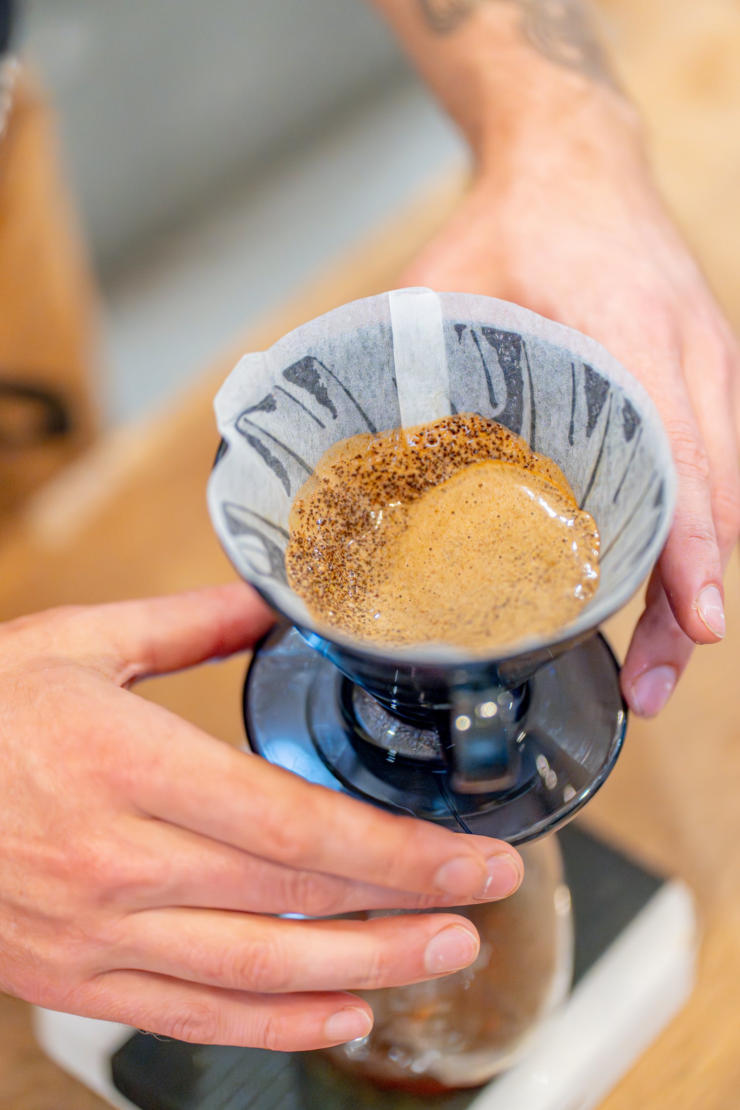 Founder of Freda Coffee using a Rao Spin to evenly distribute speciality coffee grounds in a Hario V60